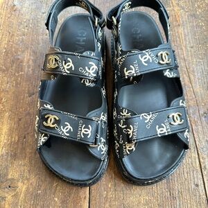 CHANEL Black Dad Sandals with Gold Accents